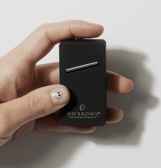 HD Brows Pro Super Shaper black sharpening tool held in a hand