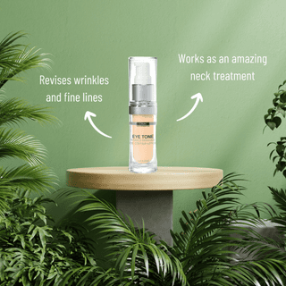 DMK Eye Tone bottle on a wooden stand with botanical greenery and product information