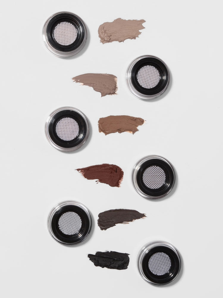 Makeup product with color swatches on a white background