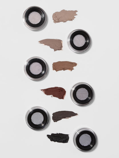 Makeup product with color swatches on a white background