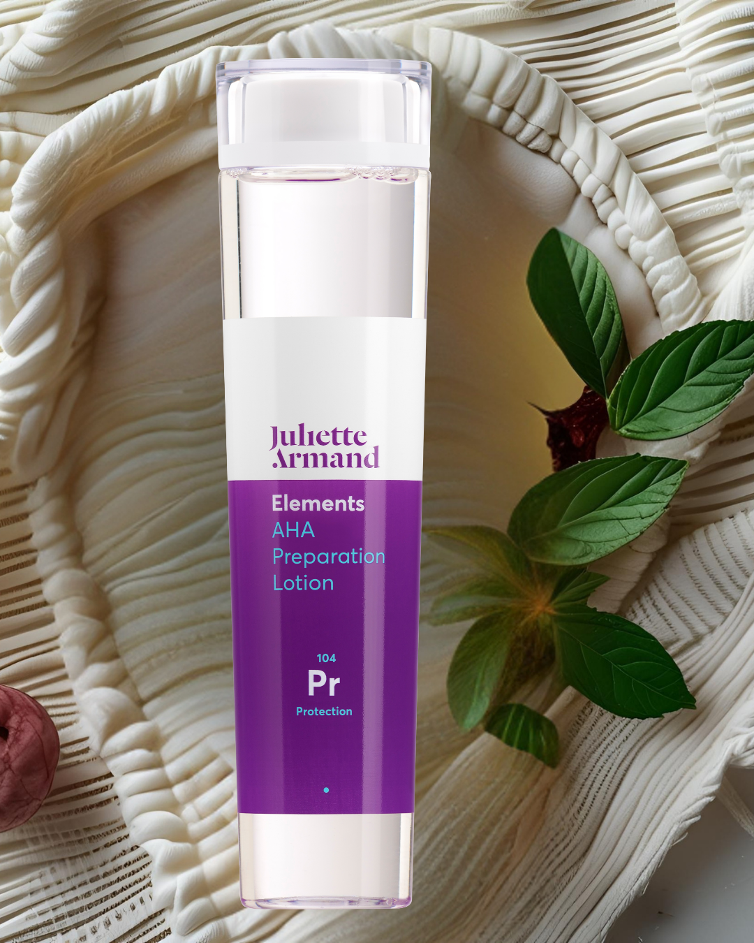 Juliette Armand skincare lotion bottle on a textured surface with leaves