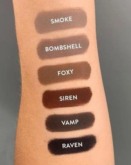 Lipstick swatches on a arm labeled 'Smoke', 'Bombshell', 'Foxy', 'Siren', 'Vamp', and 'Raven'.
