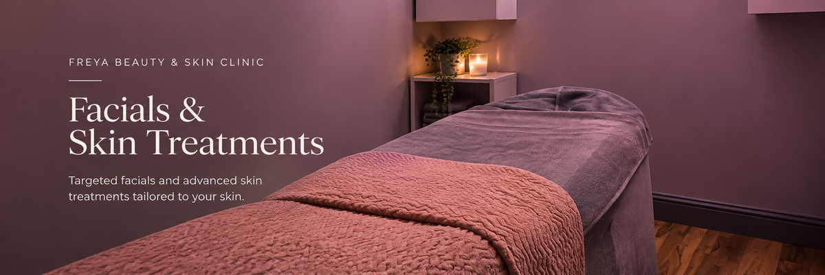 Promotional banner for Freya Beauty & Skin Clinic featuring a spa treatment bed with a pink blanket and gray headrest, set in a dimly lit room with purple walls and warm candlelight.