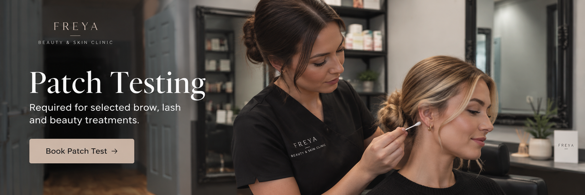 A beauty clinic scene showing a provider applying something to a woman's hair while the woman sits still. Large text on the left reads 'FREYA' and 'Patch Testing' with a 'Book Patch Test' button.
