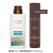 Two bottles of VITA hair care products with a focus on the new packaging design.
