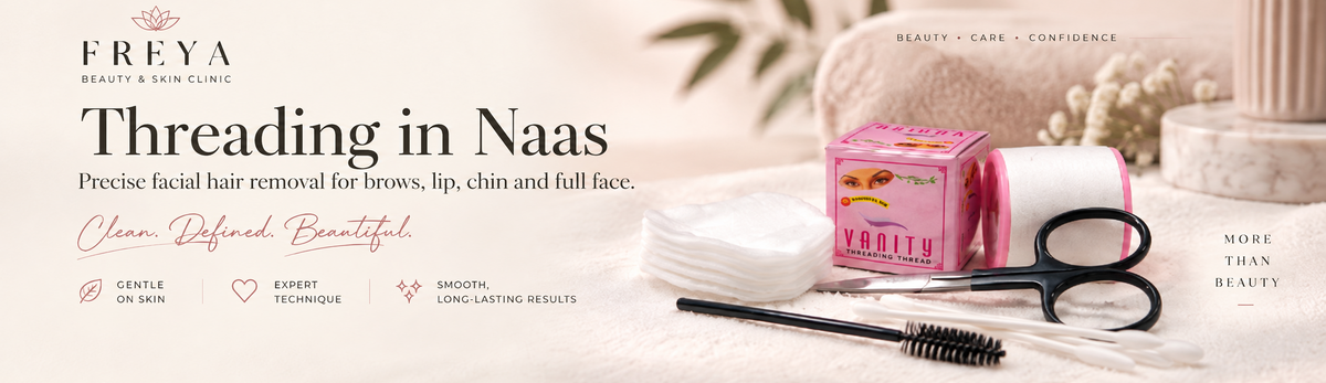 Freya Beauty & Skin Clinic promotional banner for 'Threading in Naas' facial hair removal, showing a pink branded box, black thread, a spool of white thread, and a black spool remover tool on a soft beige background with spa props.