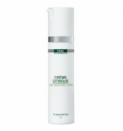 A pump bottle of DMK Crème Citrique, a brightening moisturizer for oily or uneven skin.