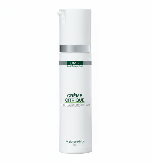 A pump bottle of DMK Crème Citrique, a brightening moisturizer for oily or uneven skin.