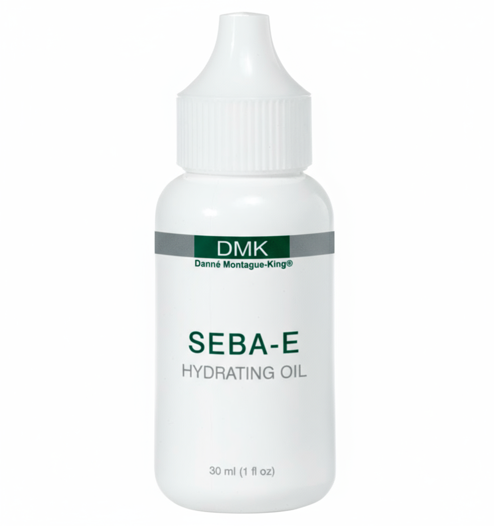 A white bottle with a pump dispenser labeled DMK Seba-E Hydrating Oil, indicating it is a skin care product.