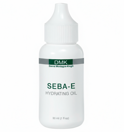 A white bottle with a pump dispenser labeled DMK Seba-E Hydrating Oil, indicating it is a skin care product.