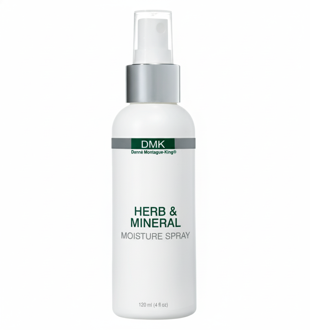 A white spray bottle labeled Herb & Mineral Moisture Spray by DMK.