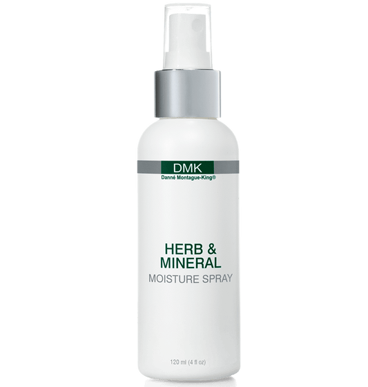 A white spray bottle labeled Herb & Mineral Moisture Spray by DMK.